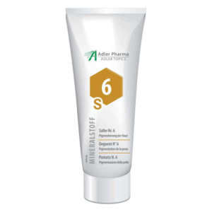Tube mit Salbe Nr. 6 zur Hautpigmentierung, weiße Verpackung mit goldener und schwarzer Beschriftung.