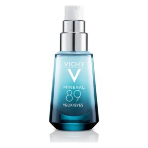 Flasche mit Vichy Mineral 89 Augenpflege, glasklares Design mit silbernem Pumpverschluss und blauer Flüssigkeit.
