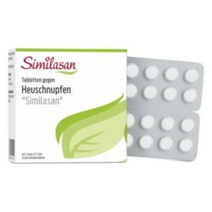 Packung mit Similasan-Tabletten gegen Heuschnupfen, grüne Blattgrafik auf der Vorderseite, Blisterverpackung sichtbar.