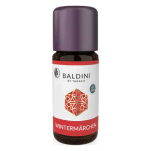 Ätherisches Öl in brauner Flasche mit lila Verschluss, etikettiert mit "WINTERMÄRCHEN" und Bio-Symbol.