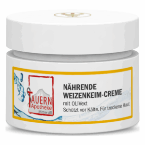 Weißer Cremebehälter mit gelbem Etikett, enthält nährende Weizenkeim-Creme für trockene Haut, schützt vor Kälte.