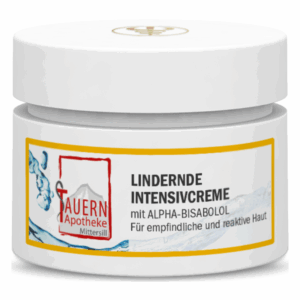 Weißes Cremetiegel mit gelbem Etikett, das die Bezeichnung "Lindernde Intensivcreme" trägt, für empfindliche Haut.