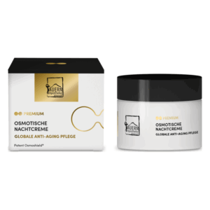 Osmotische Nachtcreme in einem weißen Glasbehälter mit schwarzem Deckel und Verpackung in einer eleganten Box.