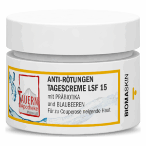 Weißer Cremetopf mit gelben und blauen Designelementen, beschriftet als Anti-Rötungen Tagescreme LSF 15.