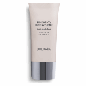 Helle Foundation in einer Tube, mit Silberverschlusstülle, beschriftet als "Anti-pollution Nude Glow Foundation".