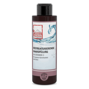 Flasche mit restrukturierender Haarspülung, enthält Ceramide-3, betont bessere Kämmbarkeit und Glanz.