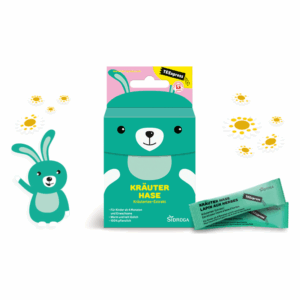 Verpackung des Kräutertees „Kräuter Hase“ in Tierform mit Teebeuteln und Gänseblümchen-Dekor.