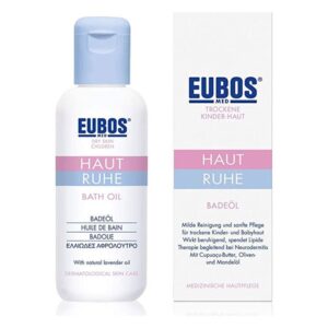 Badeöl für trockene Kinderhaut in einer weißen Flasche mit blauer Kappe und einem farblich passenden Karton.