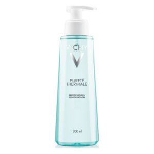 Flasche mit Vichy Pureté Thémal, erfrischendes Reinigungsöl in durchsichtiger, türkisfarbener Verpackung.