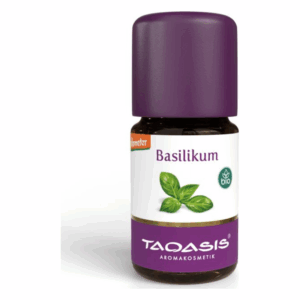 Flasche mit ätherischem Öl von Basilikum, braun mit lila Kappe, etikettiert mit biologischen Symbolen.