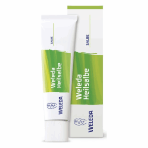 Weleda Heilsalbe in einem Tubenformat mit grünem Design und einer passenden Verpackung.