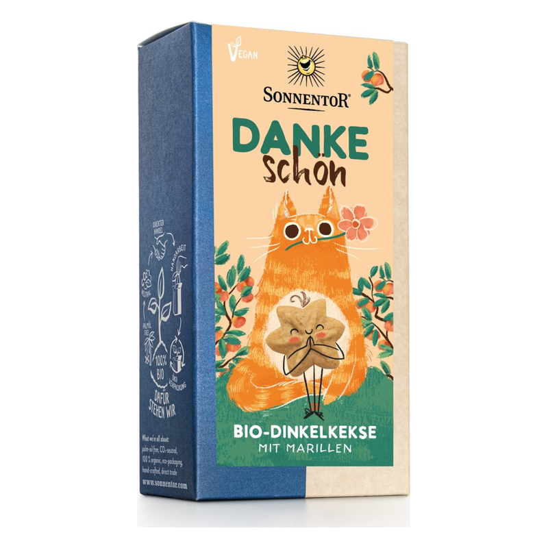 Verpackung von SONNENTOR Bio-Dinkelkeksen mit Marillen, illustrativer Katzendesign und dem Text 'Danke schön'.