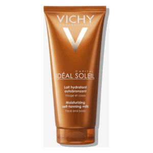 Eine braune Tube mit selbstbräunender Lotion für Gesicht und Körper von Vichy, mit silbernem Logo.