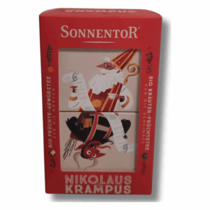 Geschenkpackung mit Bio-Tees, dekoriert mit Nikolaus und Krampus Illustrationen auf rotem Hintergrund.