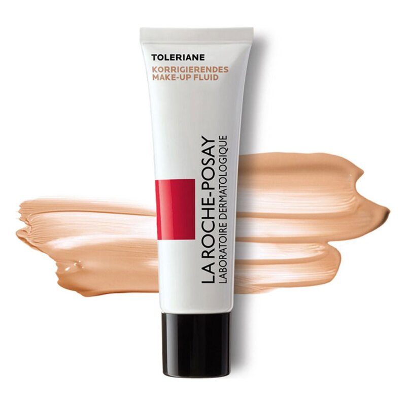 Röhre mit korrigierendem Make-up Fluid von La Roche-Posay, umgeben von einer Makeup-Farbe in Hauttönung.