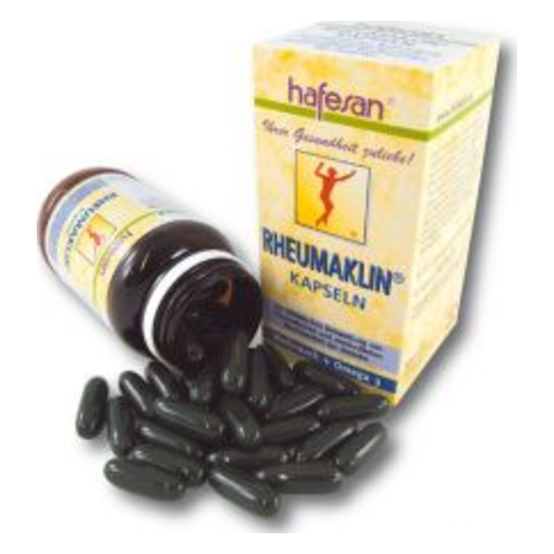 Eine geöffnete Flasche mit schwarzen Kapseln und einer dazugehörigen Verpackung von Rheumaklin.