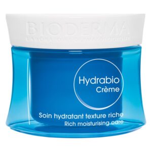 Eau-reiche Hautpflegecreme in einem blauen Glasbehälter mit einem weißen Deckel und beschriftetem Etikett.