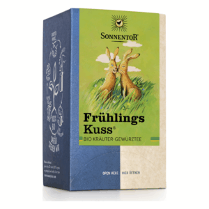 Verpackung des Bio Kräutergewürzttees "Frühlings Kuss" mit zwei zeichnerischen Kaninchen und buntem Design.