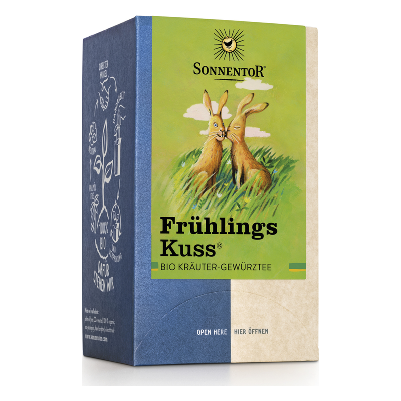 Verpackung des Bio Kräutergewürzttees "Frühlings Kuss" mit zwei zeichnerischen Kaninchen und buntem Design.