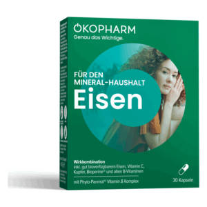 Packung für Nahrungsergänzungsmittel mit Eisen, grün, enthält Vitamin C, Kupfer und B-Vitamine, abgebildete Frau im Hintergrund.