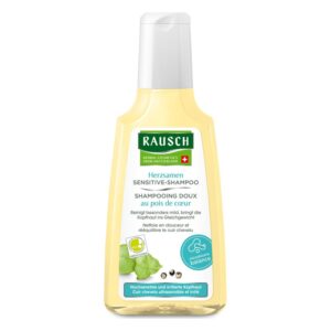 Flasche mit Rausch Herzsamen Sensitive-Shampoo, gelblich mit weißem Etikett und Spender, für sensible Kopfhaut.