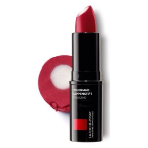 Roter Lippenstift in schwarzer Verpackung mit weißer Kappe, daneben eine runde, rot-weiße Textur.