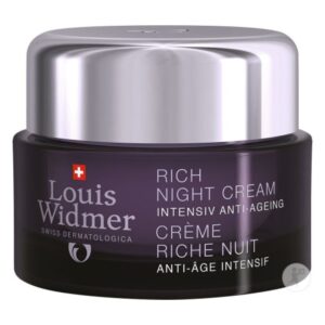 Reichhaltige Anti-Aging Nachtcreme in einem dunkelvioletten Glasbehälter mit silbernem Deckel.