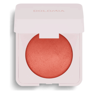 Rosa Rouge in einer weißen, quadratischen Verpackung mit einem runden, schimmernden Puderbehälter.