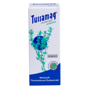 Verpackung des Tussamag Hustenstifts in einer weißen Box mit grünem Thymianblatt-Design und blauer Schrift.