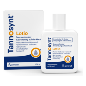 Tannosynt Lotio in einer weißen Flasche mit blauer Schrift und einer Verpackungskartonage, zur Anwendung auf der Haut.