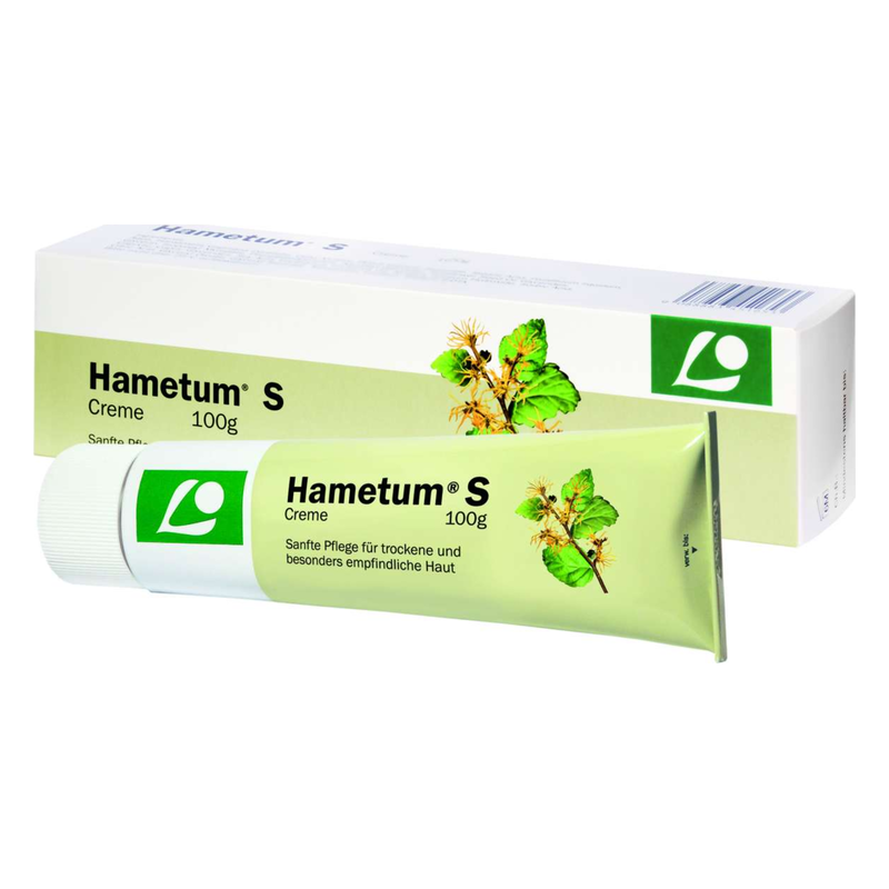 Tube Hametum S Creme für trockene und empfindliche Haut, umgeben von einer Verpackung mit Pflanzenmotiven.