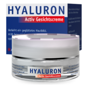 Hyaluron Activ Gesichtscreme in einem transparenten Tiegel mit lila Deckel vor einer blau-weißen Verpackung.