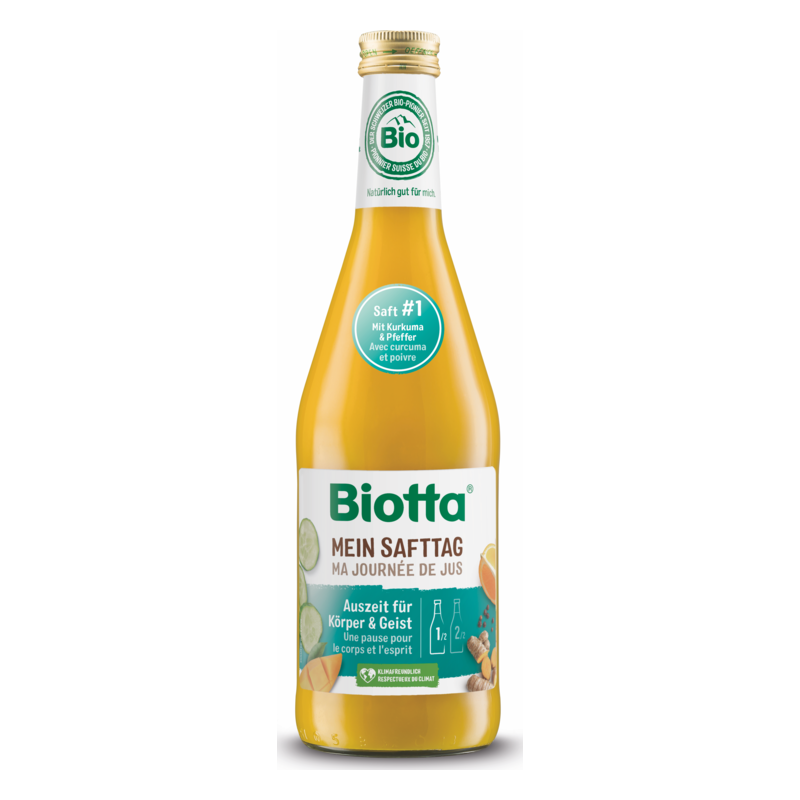 Eine Flasche Biotta Saft mit gelbem Inhalt, Etikett weist auf Kurkuma und Pfeffer hin, Bio-Siegel sichtbar.