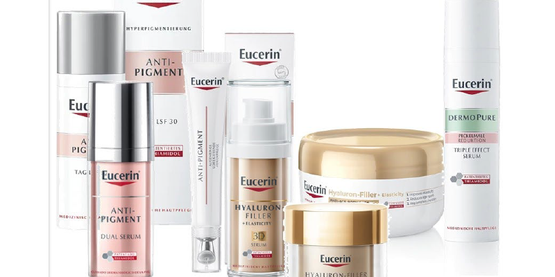 Eucerin-Thiamidol.png Verschiedene Eucerin Hautpflegeprodukte mit verschiedenen Verpackungen, darunter Tuben, Pumpflaschen und Tiegel.