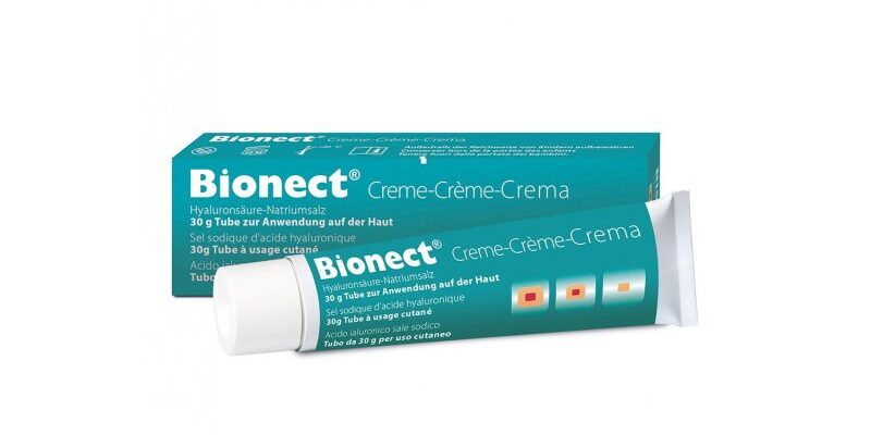 Bionect Creme in einem 30 g Tube, verpackt in einer turquoise-blauen Schachtel mit mehrsprachiger Beschreibung.