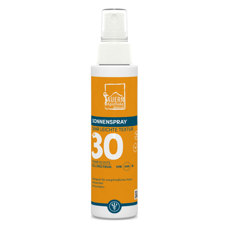 Sonnenspray in einer weißen Flasche mit orangefarbenem Etikett, Lichtschutzfaktor 30, für empfindliche Haut.