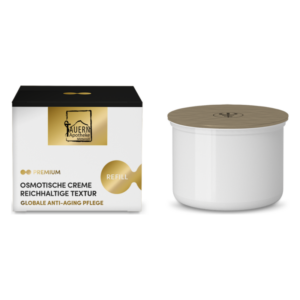 Verpackung einer osmotischen Creme mit reichhaltiger Textur in einer weißen Dose und schwarzem Karton mit goldenen Akzenten.