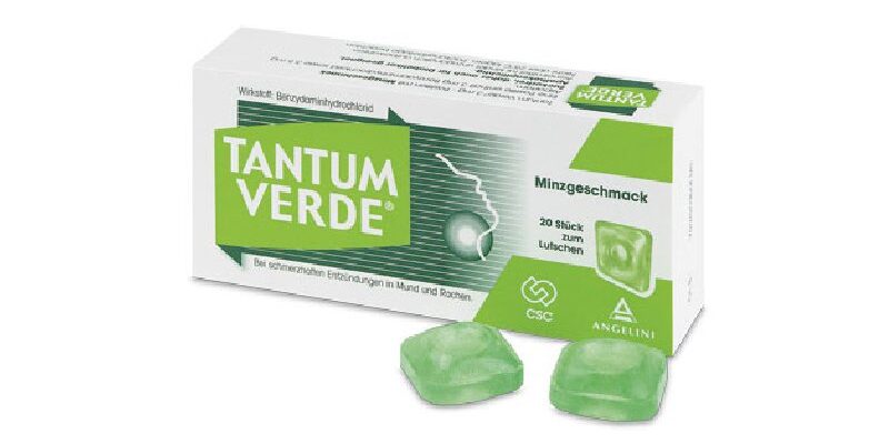 tantum_verde_minze.jpg Packung mit Tantum Verde Lutschtabletten in Minzgeschmack, zwei Tabletten liegen daneben.