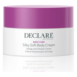 Runde, weiße Cremeverpackung mit lila Deckel, beschriftet mit "Declare Silky Soft Body Cream".