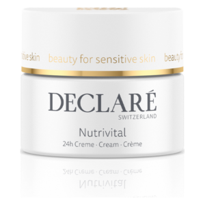 Weißer Cremetiegel mit goldfarbenem Deckel, beschriftet mit "Nutrivital" und "beauty for sensitive skin".