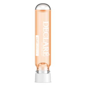 Durchsichtige Ampulle mit orangefarbenem Inhalt und silberner Kappe, beschriftet mit 'DECLARE VITALBALANCE'.