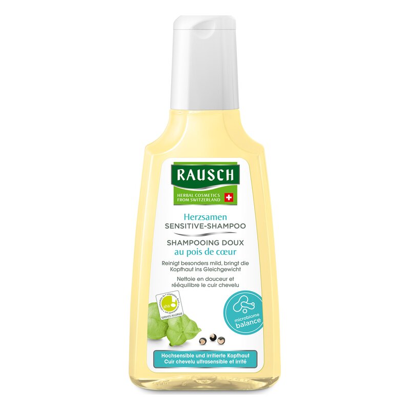 Flasche mit Rausch Herzsamen Sensitive-Shampoo, gelblich mit weißem Etikett und Spender, für sensible Kopfhaut.