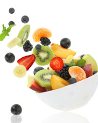 Fresh fruits coming out from a bowl